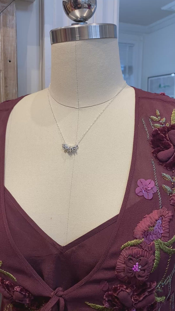 Video of sterling silver necklace by artist/maker Ree Gallagher with a gorgeous one inch cluster of silver swarovski cystals as the centerpiece