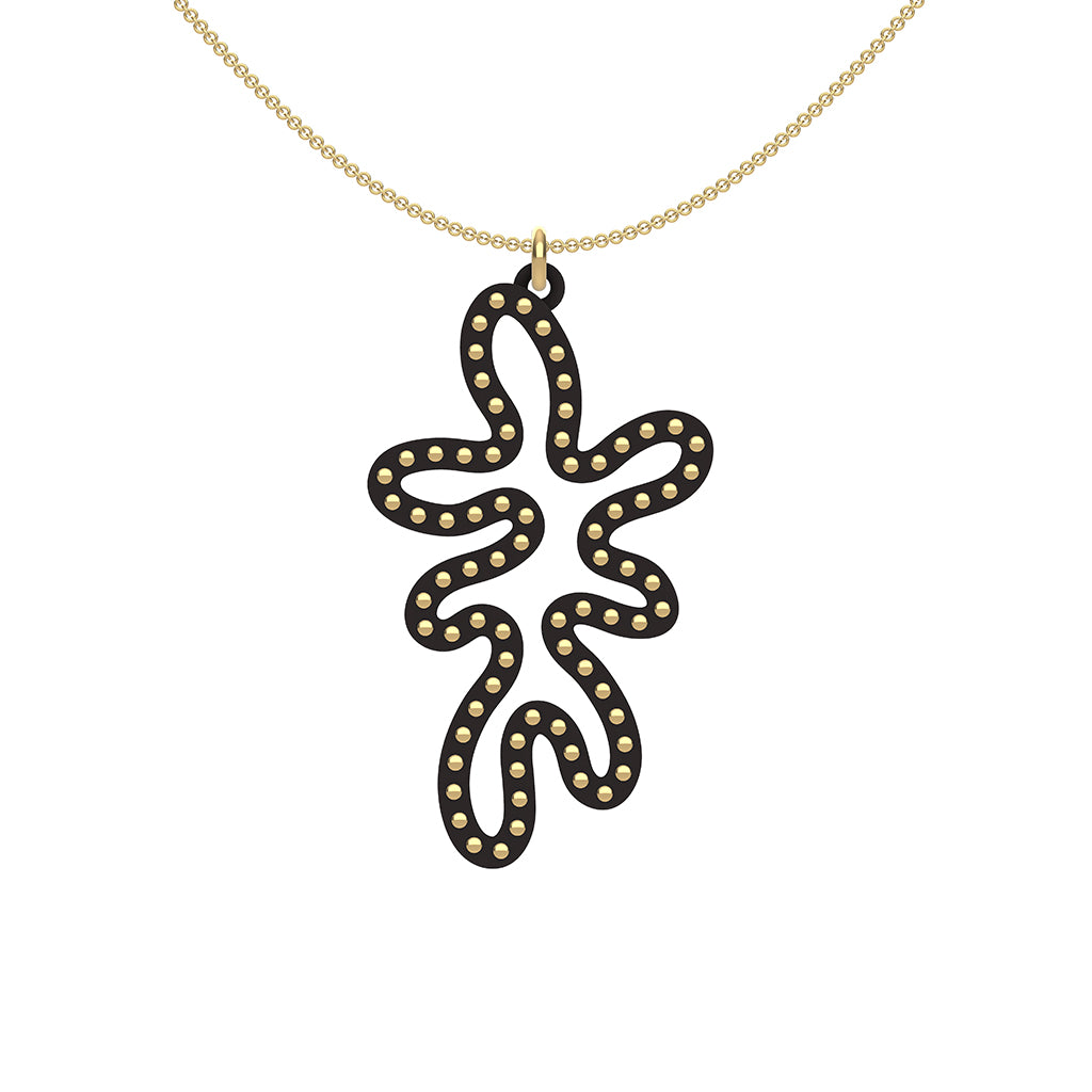 MATISSE.cutout  CORAL pendant  STYLE:  5   vertical coral shape  with 14/20 goldfill studs along shape  COLOR:   black    MATERIAL:  3D printed Nylon  ARTIST:  Ree Gallagher, USA