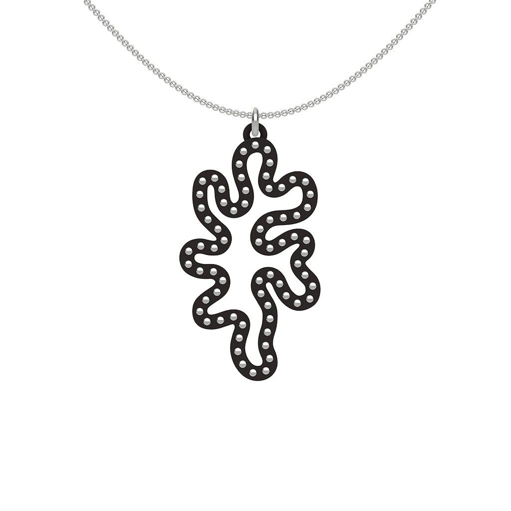 MATISSE.cutout CORAL pendant STYLE: 1 with sterling silver studs along shape COLOR: black MATERIAL: 3D printed Nylon ARTIST: Ree Gallagher, USA