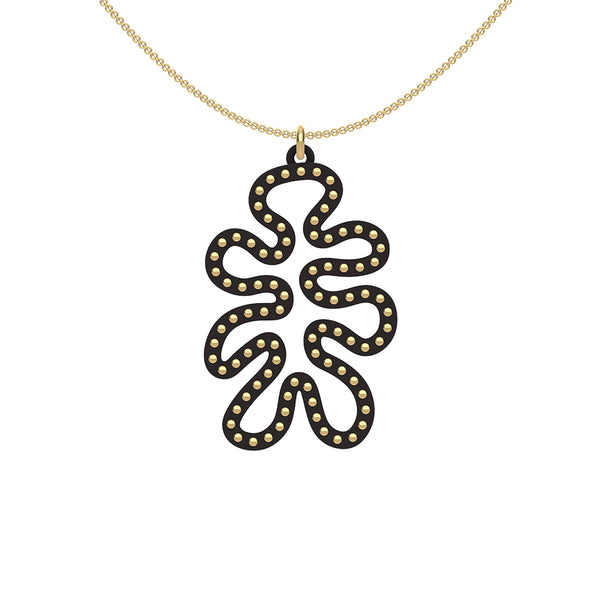 MATISSE.cutout  CORAL pendant  STYLE:  4 , funky vertical shape  with 14/20 goldfill studs along shape  COLOR:   black    MATERIAL:  3D printed Nylon  ARTIST:  Ree Gallagher, USA