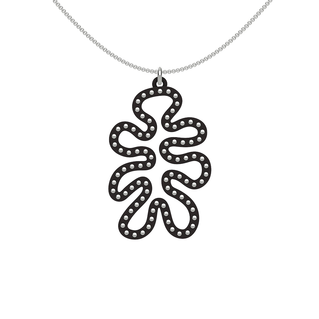 MATISSE.cutout  CORAL pendant  STYLE:  4 , funky vertical shape  with sterling studs along shape  COLOR:   black    MATERIAL:  3D printed Nylon  ARTIST:  Ree Gallagher, USA