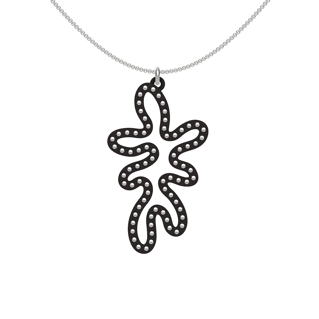 MATISSE.cutout  CORAL pendant  STYLE:  5   vertical coral shape  with sterling  studs along shape  COLOR:   black    MATERIAL:  3D printed Nylon  ARTIST:  Ree Gallagher, USA