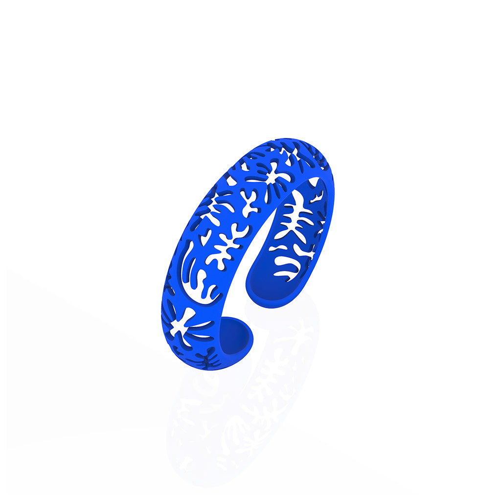 CORAL cutout CUFF bracelet inspired by artist Henri Matisse.  Color is  BLUE.  Measures 3/4 of inches wide.  ONE SIZE fits most .  Made of lightweight nylon