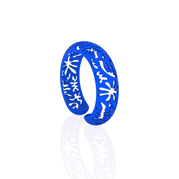 CORAL cutout CUFF bracelet inspired by artist Henri Matisse.  Color is  BLUE.  Measures 3/4 of inches wide.  ONE SIZE fits most .  Made of lightweight nylon
