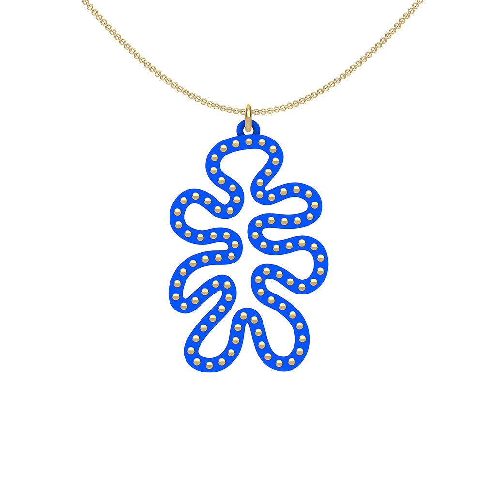MATISSE.cutout  CORAL pendant  STYLE:  4 , funky vertical shape  with 14/20 goldfill studs along shape  COLOR:   royal blue    MATERIAL:  3D printed Nylon  ARTIST:  Ree Gallagher, USA