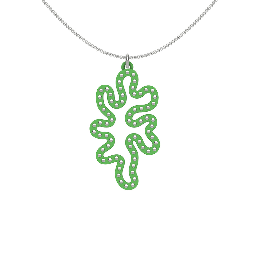 MATISSE.cutout  CORAL pendant  STYLE:  1  with sterling silver studs along shape  COLOR:  grass green    MATERIAL:  3D printed Nylon  ARTIST:  Ree Gallagher