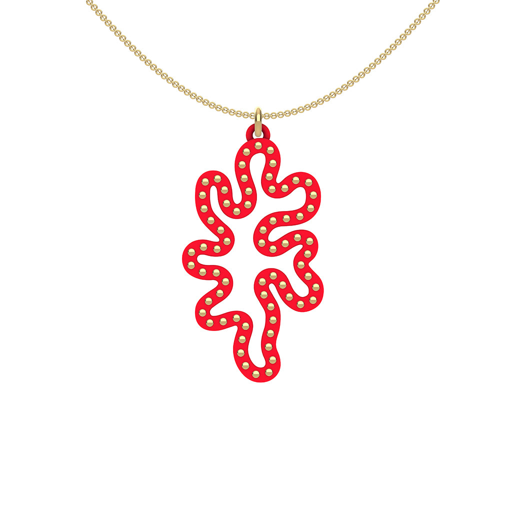 MATISSE.cutout  RED CORAL pendant  STYLE:  1  with 14/20 goldfill studs along shape     MATERIAL:  3D printed Nylon  ARTIST:  Ree Gallagher