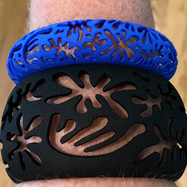 CORAL cutout CUFF bracelet inspired by artist Henri Matisse.  Color is  BLACK.  Measures 1.5 inches wide.  ONE SIZE fits most .  Made of lightweight nylon