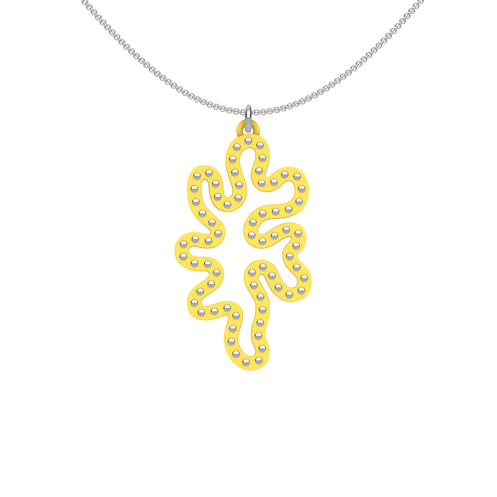 MATISSE.cutout  CORAL pendant  STYLE:  1  with sterling silver  studs along shape  COLOR:  white   MATERIAL:  3D printed Nylon  ARTIST:  Ree Gallagher
